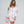 Amara - Túnica de algodón bordado blanco/rosa con mangas largas y detalles de borla