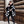 Ashlee - Avvolgimento in maglia testurizzata nera/crema con collare in finta pelliccia