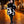Ashlee - Avvolgimento in maglia testurizzata nera/crema con collare in finta pelliccia