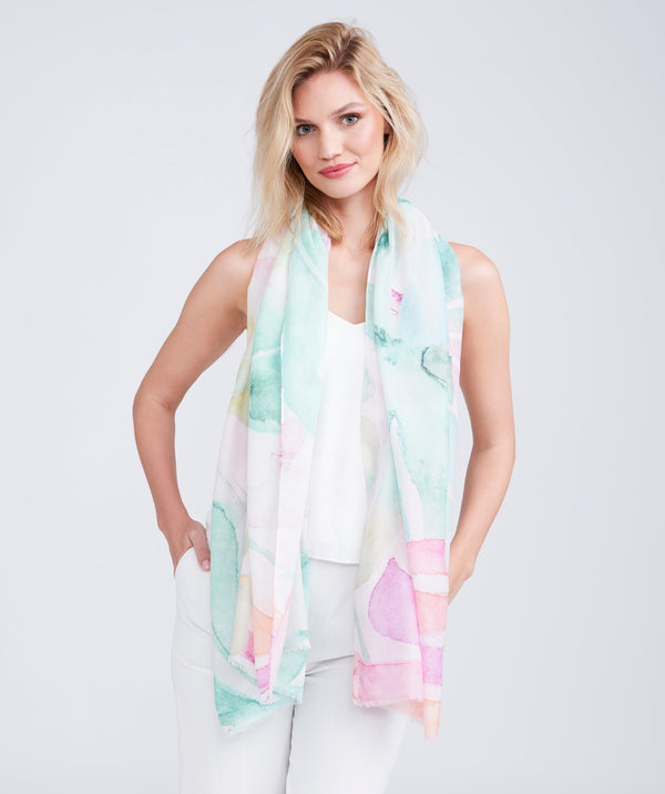 Alice blue oblong spring summer scarf featuring a bold oversized leaf print in vibrant multicoloured tones for a statement finish. Made from soft, lightweight fabric designed for easy draping and versatile styling.