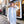 An oblong scarf featuring an all-over shimmer finish for a subtle sparkling effect. Designed with raw edges for a modern, relaxed look and lightweight comfort. Suitable for versatile styling across casual and formal outfits.