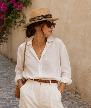 Natural straw fedora hat with ribbon trim, adjustable fit and UPF 50 sun protection for beach, holiday and summer outdoor wear.