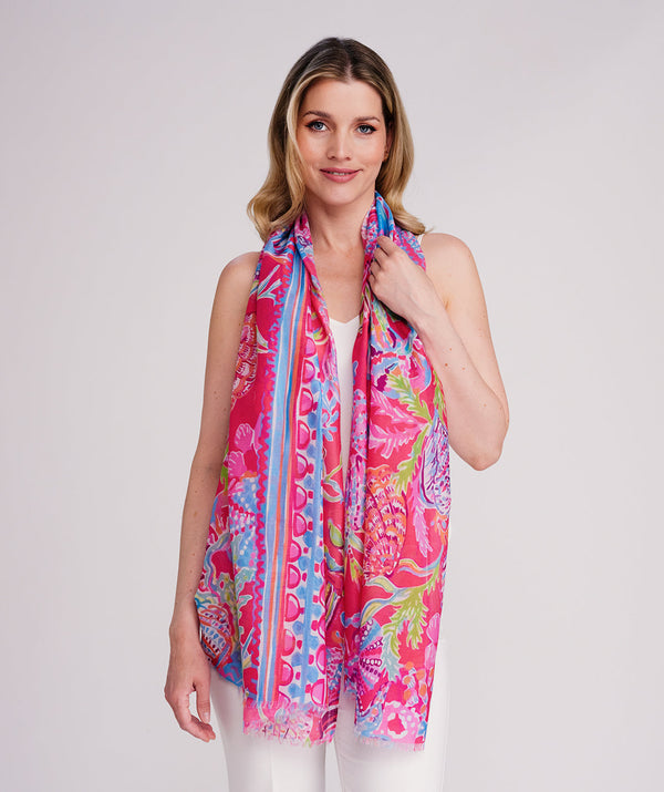 Pink oblong scarf featuring a vibrant abstract print in soft pink hues for a fresh seasonal statement. Crafted from lightweight chiffon with a flowy drape and raw edge hemline for a modern finish. Suitable for versatile styling as a neck scarf, wrap, or shoulder accessory.