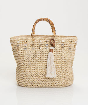 Natural woven straw tote bag with crochet weave, double handles and tassel detail. Lightweight beach, holiday, shopping and everyday bag.